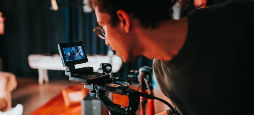 photo-of-a-man-holding-video-camera-1024x467